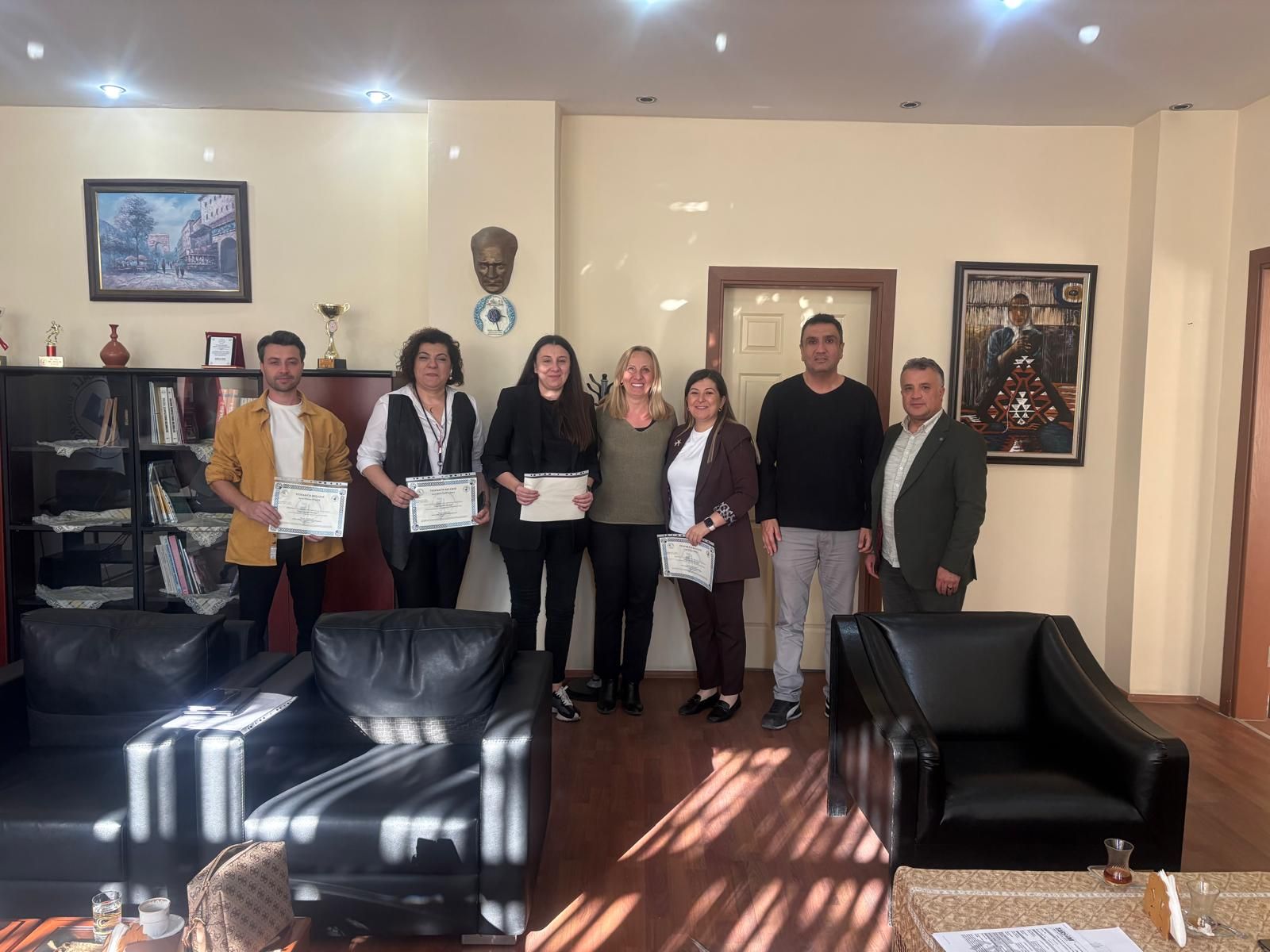 DESAD representatives and Buldan Vocational School management with certificates of appreciation after the conference
